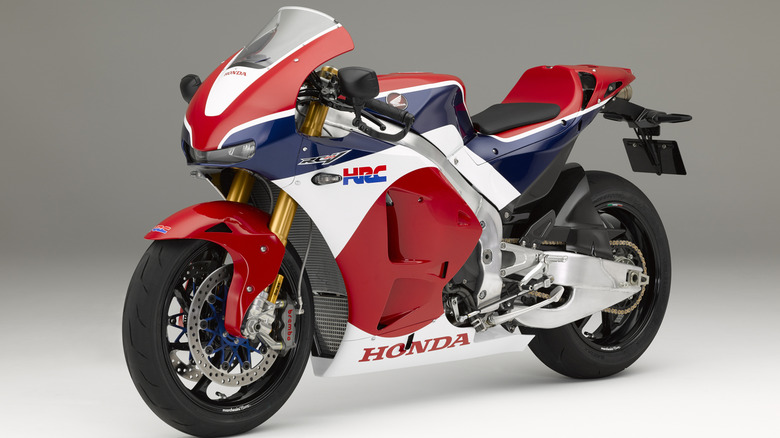 A 2015 Honda RC213V-S on a white studio background.