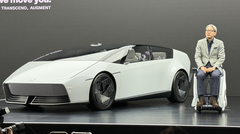 Honda CEO Toshihiro Mibe next to the Honda 0 Series Saloon concept