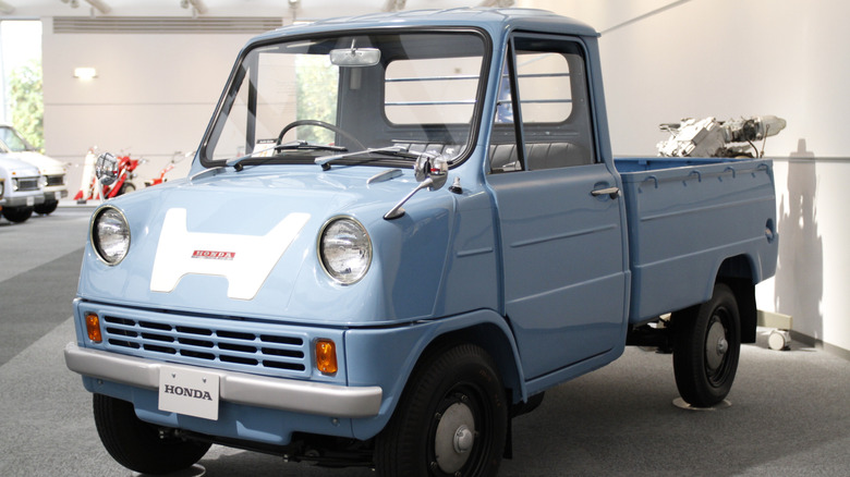 Honda T360 pickup truck displayed in a museum.