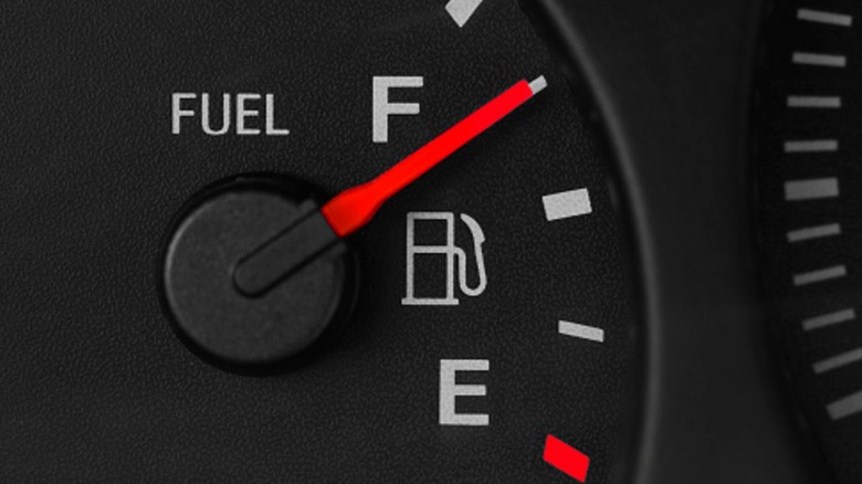 A car's fuel gauge showing an almost full tank