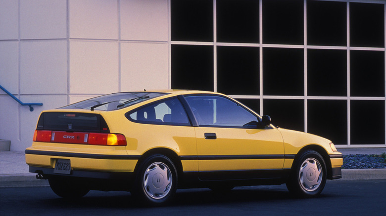 A rear-quarter shot of a yellow 1989 Honda CRX