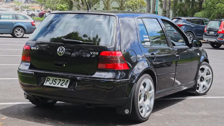 Rear 3/4 of VW Golf VR5 in parking lot