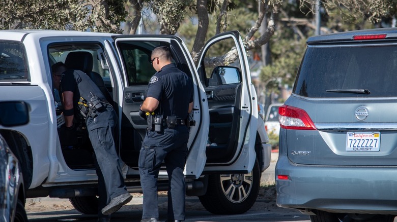 Officers conduct search of pickup truck