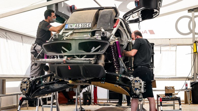 An Audi mechanic working on their car during the rest day of the Dakar Rally 2022 around Riyadh, Saudi Arabia