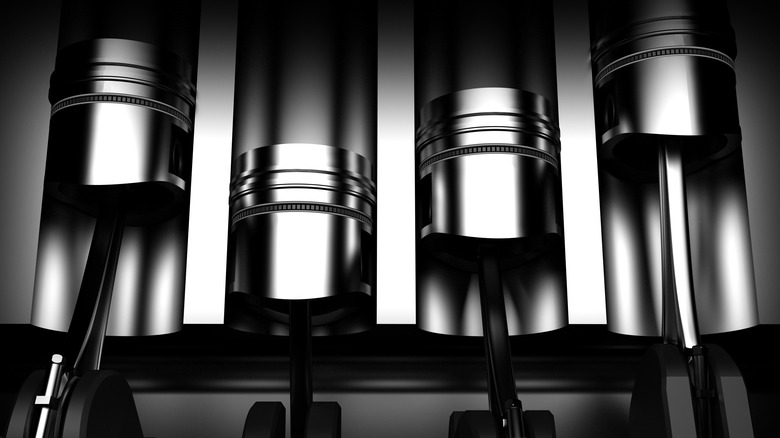 A 4-cylinder engine cutaway showing the pistons in the cylinders.