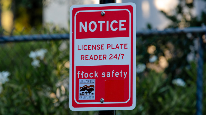 Sign notifying people of Flock camera surveillance