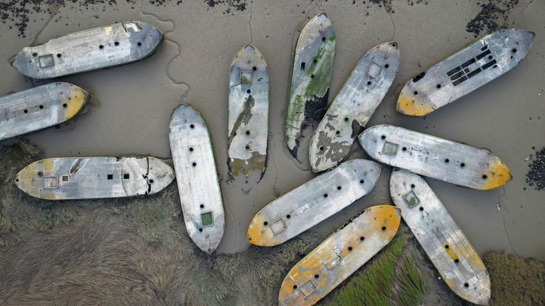 Aerial view of concrete barges sunk on the River Thames