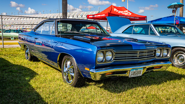 A blue 1969 Plymouth Road Runner 426 Hemi in a car meet