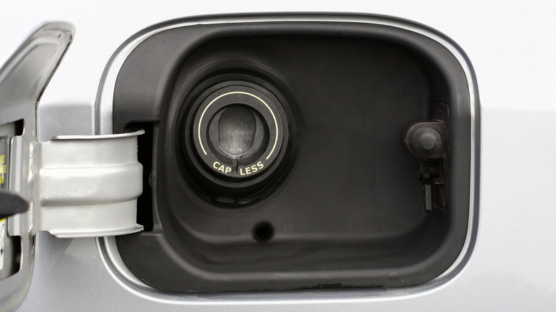 A capless fuel filler on a silver vehicle