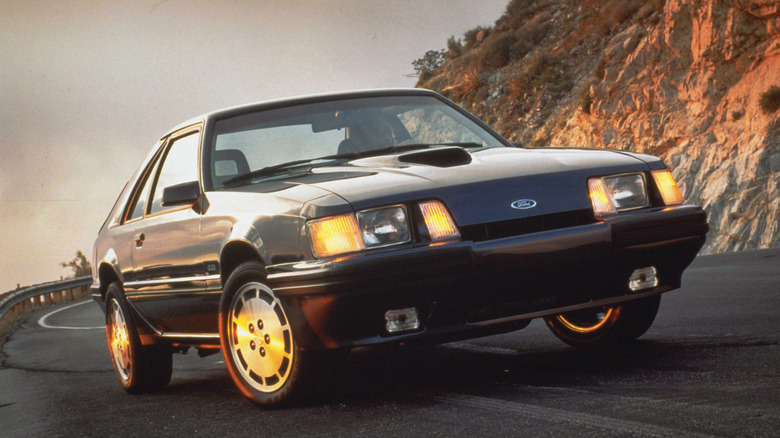 Ford SVO Mustang parked on a mountain road