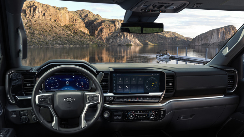Looking out on a lake from the interior of a 2026 Chevrolet Silverado 1500.