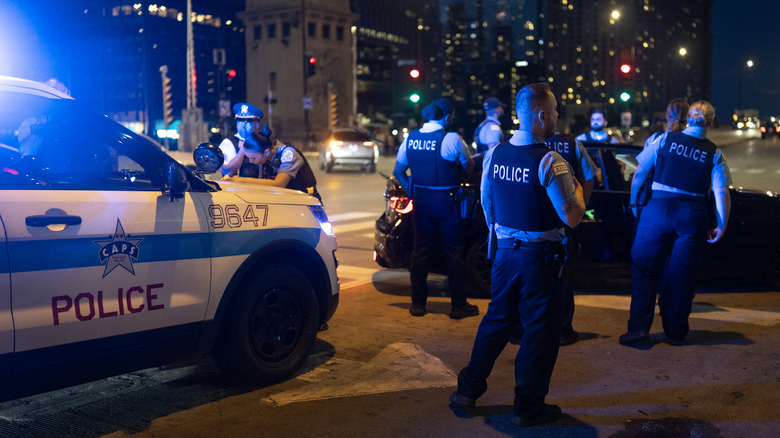 Police pull over a driver for displaying a Mexican flag on his vehicle as he celebrates Mexican Independence Day in the Loop on September 13, 2025 in Chicago, Illinois. Police were writing citations to drivers for displaying the flags and confiscating sticks pedestrians were using to display flags. The city and surrounding area has been holding several Independence Day celebration over the past week, while many others have been cancelled due to fears surrounding the Trump administration's Operation Midway Blitz, which is a surge in arrests of undocumented immigrants.
