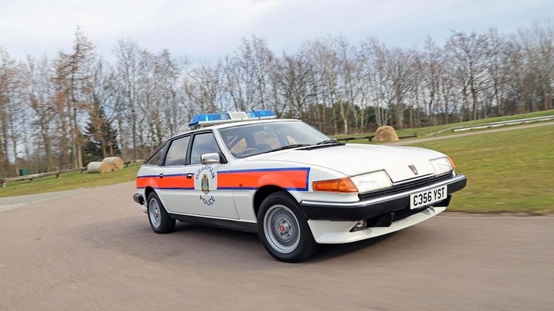 Front-quarter dynamic shot of a Rover SD1 police car on track.