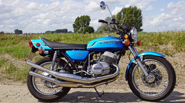 A blue Kawasaki H2 Mark IV on the side of the road