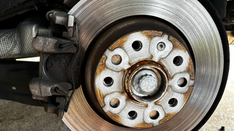 Worn brake rotor with visible scarring and grooves