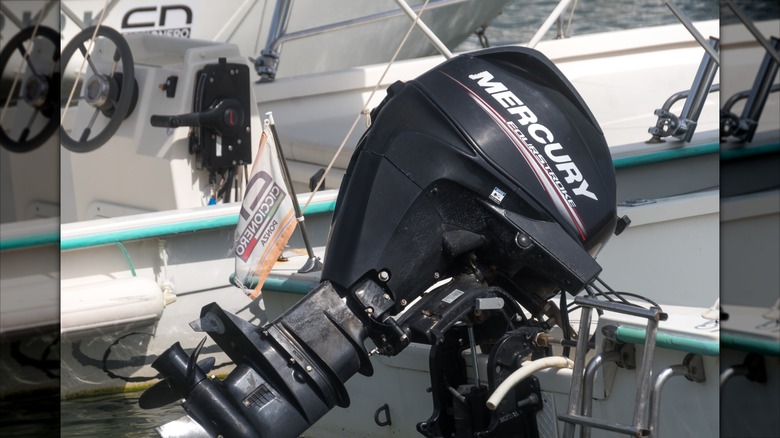 A Mercury outboard engine mounted on the stern of a boat.