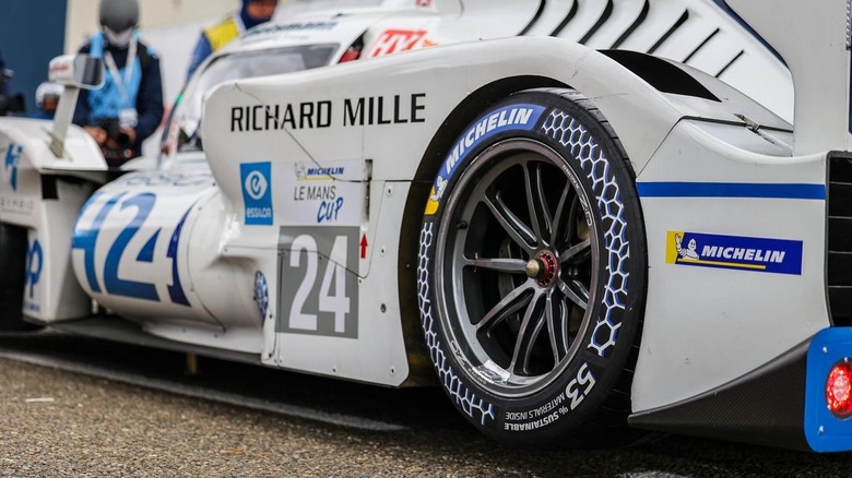 The rear Michelin racing tires of an endurance racing car that's made from 50% recyclable and renewable materials