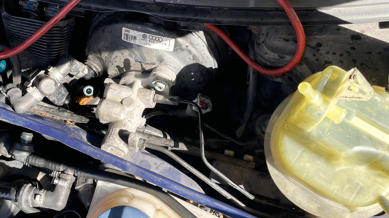 Replacing a broken brake fluid reservoir on a 2002 Audi S4.