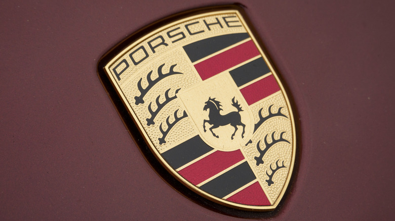 A close-up view of a Porsche logo