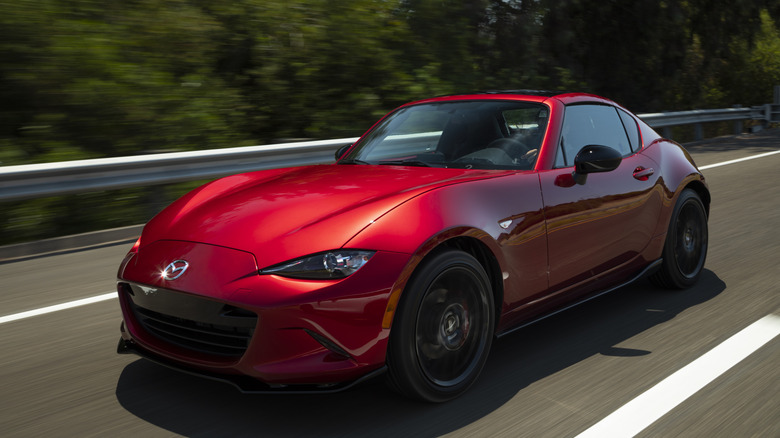 Red 2019 Mazda MX-5 Miata RF driving on highway
