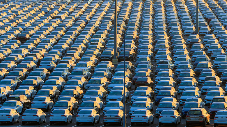 An aerial view of an outdoor car park filled with Volkswagens.