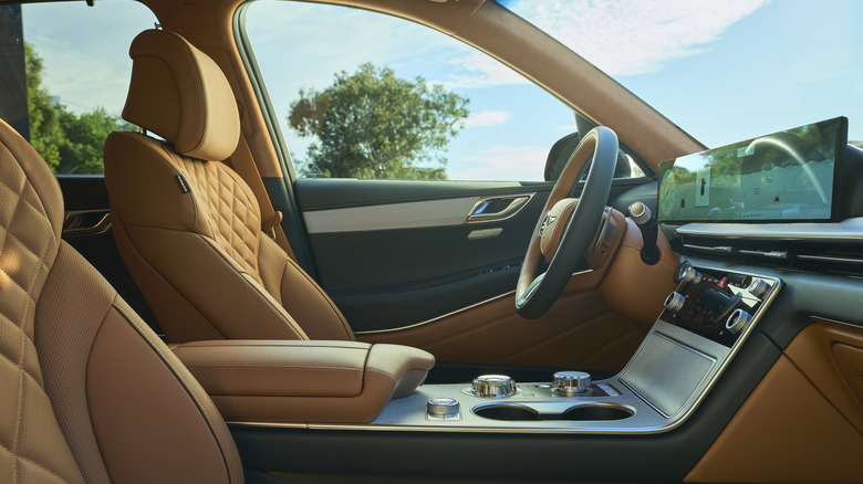 A 2025 Genesis GV80 interior with a view of the driver's seat and steering wheel