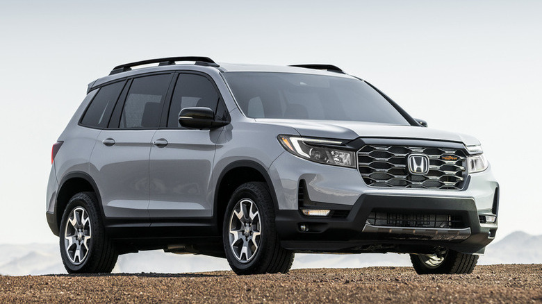 Front 3/4 2022 Honda Passport TrailSport parked on gravel