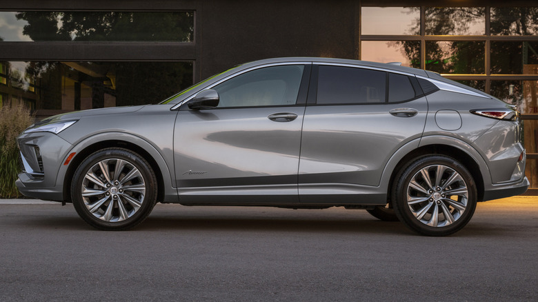 A silver 2024 Buick Envista Avenir in front of a building