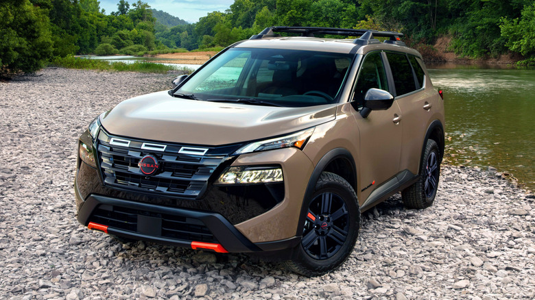 2025 Nissan Rogue Rock Creek edition parked next to a creek