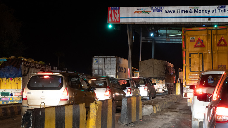Night shot of vehicles waiting at NHAI toll booth