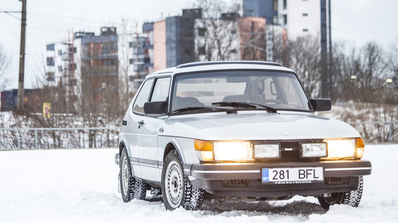 An '80s Saab Turbo in its element: on snow tires, sitting in snow, and ready to have some fun.