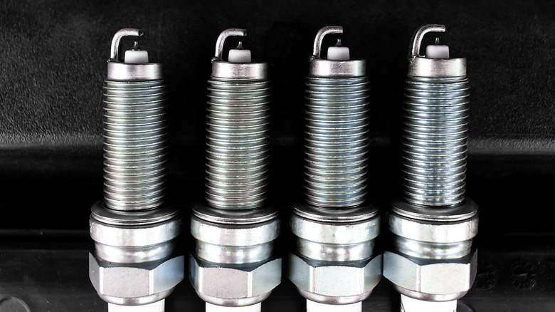 Closeup of 4 caller Iridium spark plugs