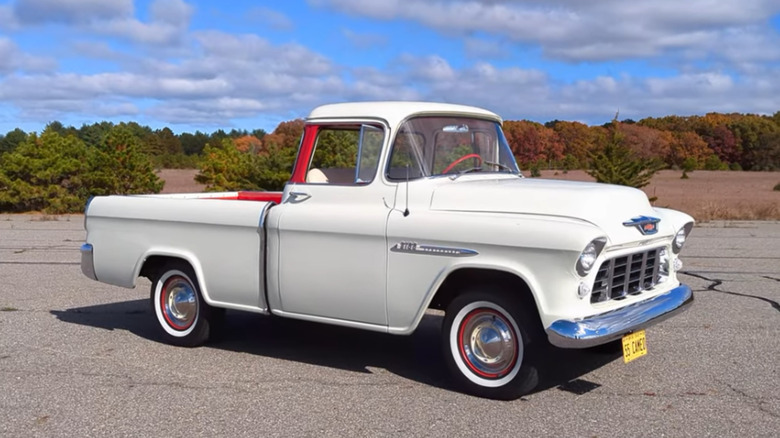 Front 3/4 of 1955 Chevrolet Cameo Carrier pickup white with red accents