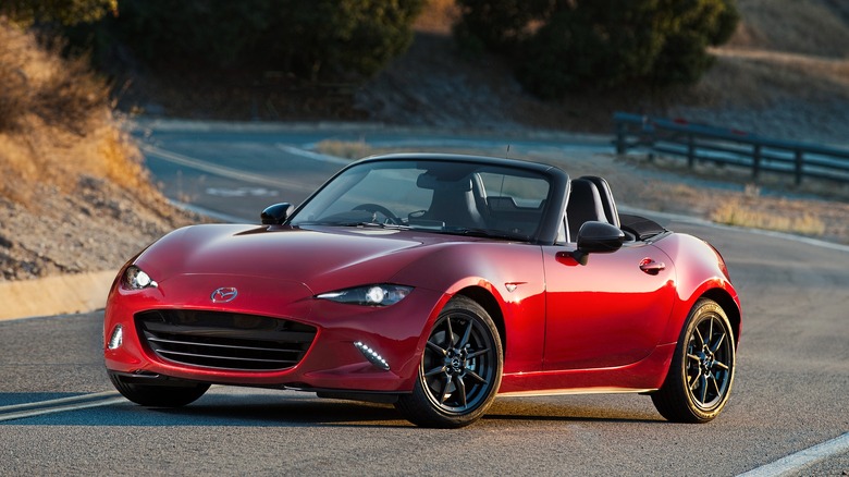 A 2016 ND Mazda Miata in red on a curvy road
