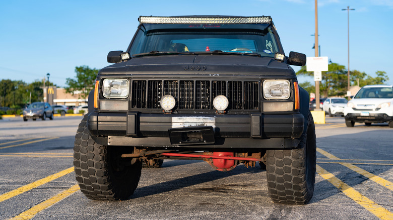 Front view of a modified black XJ Jeep Cherokee