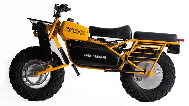 A side-view of a yellow Rokon Trail-Breaker