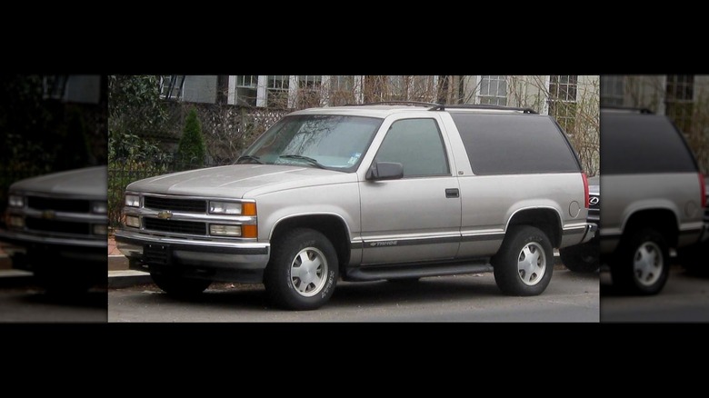 A silver 2-door Chevrolet Tahoe.