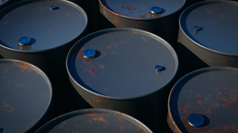 A close-up shot of several oil barrels placed close together