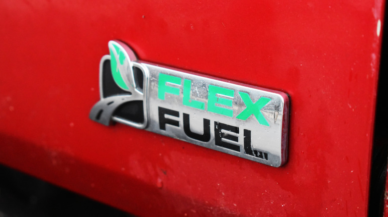 A Flex Fuel badge on a red Ford F-150 truck