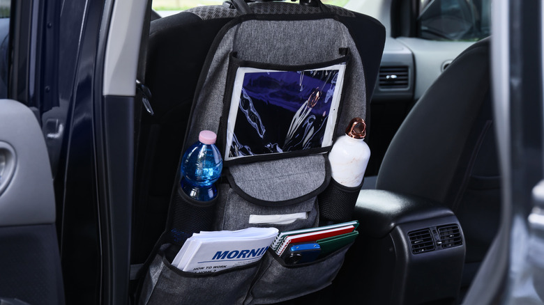 Car seat organizer loaded with daily essentials