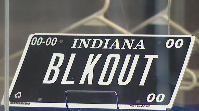 A close-up of a blackout license plate