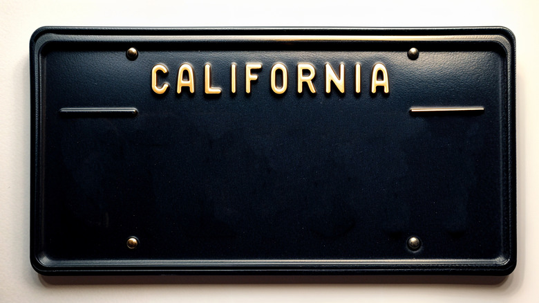 A close-up of a blank California black license plate