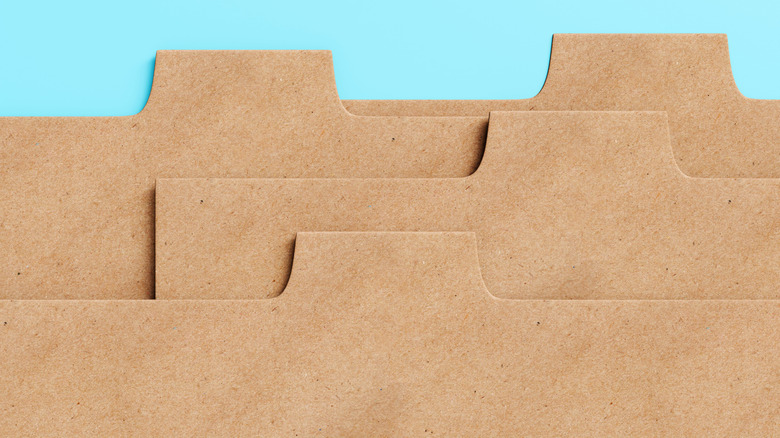 Folder tabs stand out against a blue background.