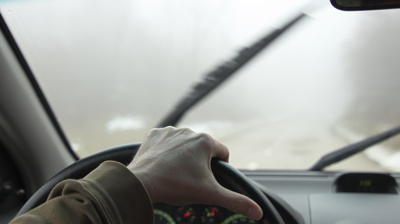 Driving in the winter with fog on the windshield
