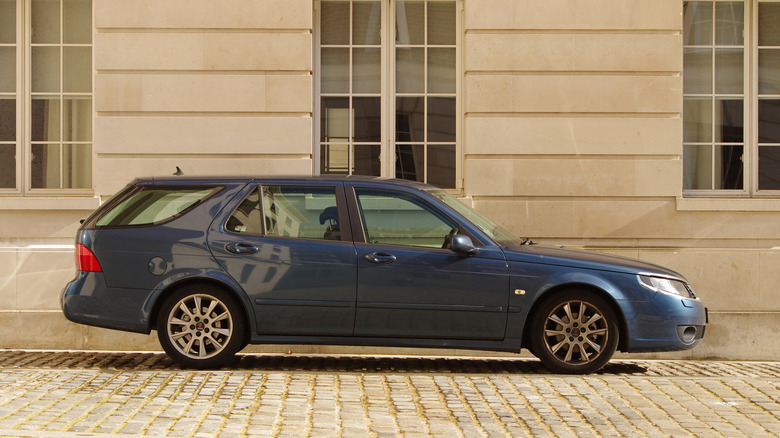 A side-profile of a blue Saab 9-5 SportCombi