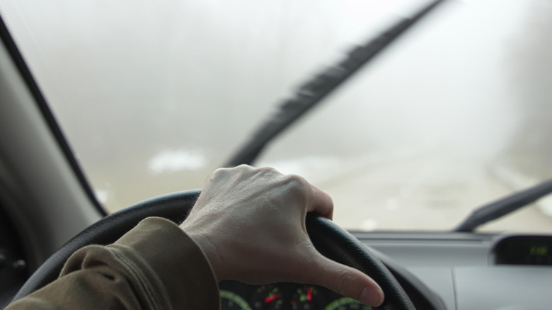 Driving in the winter with fog on the windshield