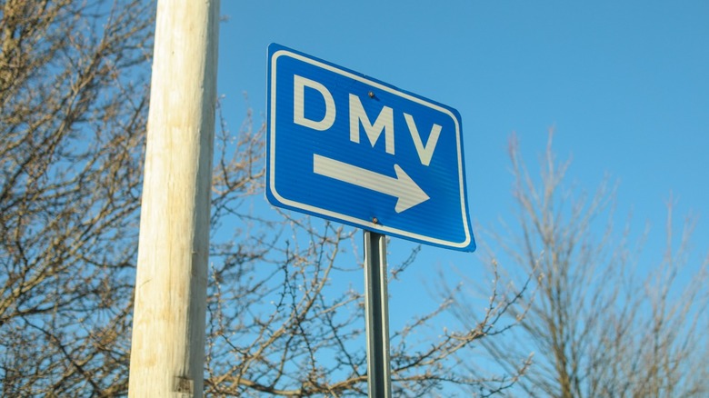 Blue sign that reads "DMV"