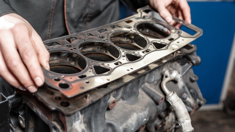 A cylinder head gasket removed from the engine block.
