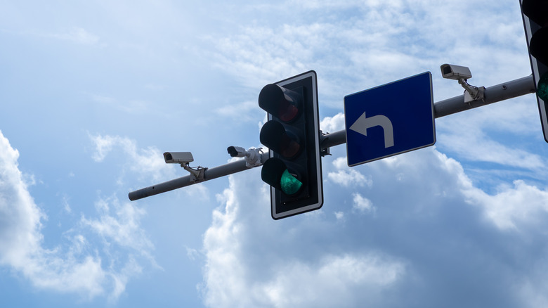 A traffic signal with camera sensors mounted nearby