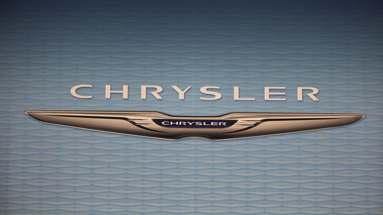 A large Chrysler logo at the display center of the 2025 Detroit Auto Show